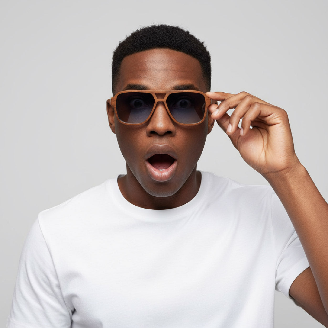 Man wearing sunglasses with a neutral background