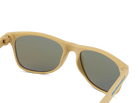 Beige sunglasses with dark lenses on a white background