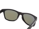 Black sunglasses with green lenses on a white background