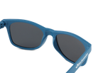 Blue sunglasses with dark lenses on a white background