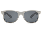 Sunglasses with gray frames and dark lenses on a white background