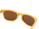 Yellow sunglasses with brown lenses on a white background