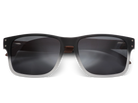 Black sunglasses with dark lenses on a white background