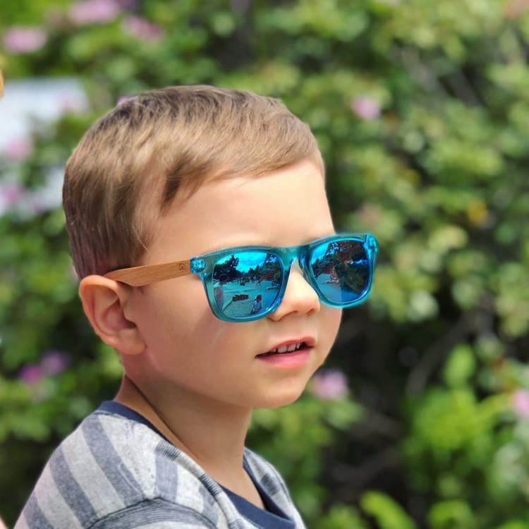 Kid with blue wildwood sunglasses