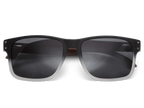 Black sunglasses with dark lenses on a white background