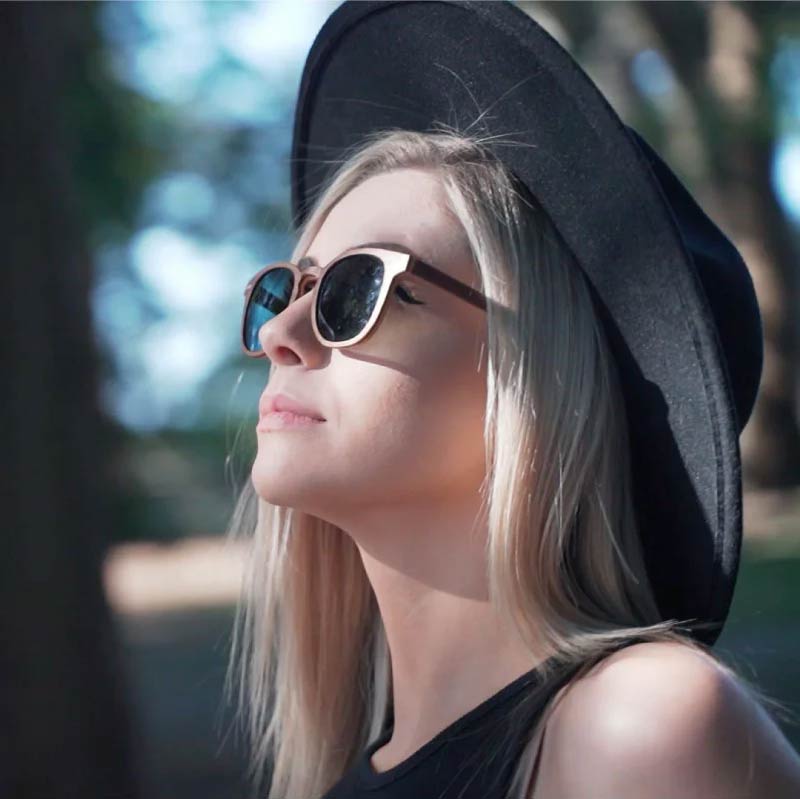 Woman wearing Wildwood wooden sunglasses