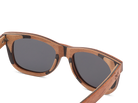 Wooden-framed sunglasses with dark lenses on a white background