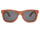 Wooden sunglasses with dark lenses on a white background