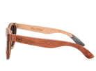 Wooden sunglasses with 'Monopoli' branding on a white background