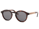 Sunglasses with tortoiseshell frame and dark lenses on a white background