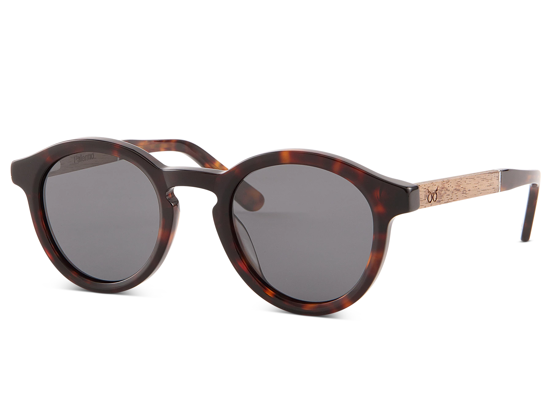 Sunglasses with tortoiseshell frame and dark lenses on a white background