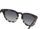 Sunglasses with tortoiseshell frame and dark lenses on a white background